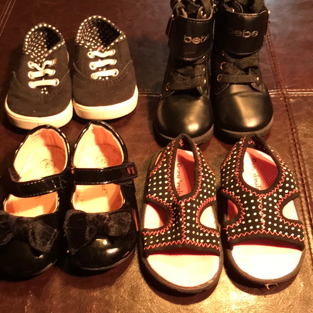 Four pairs of girls size 5 toddler shoes.